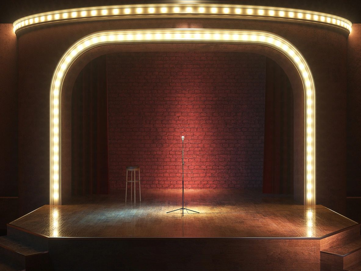 A stage with lights and a microphone on it
