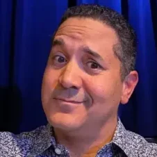 A man with a goofy look on his face.